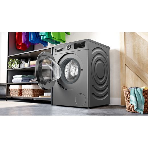 Bosch WGG244ZCGB 9.0kg Washing Machine with 1351 rpm - Graphite - Washing machine in utility room with door open shot